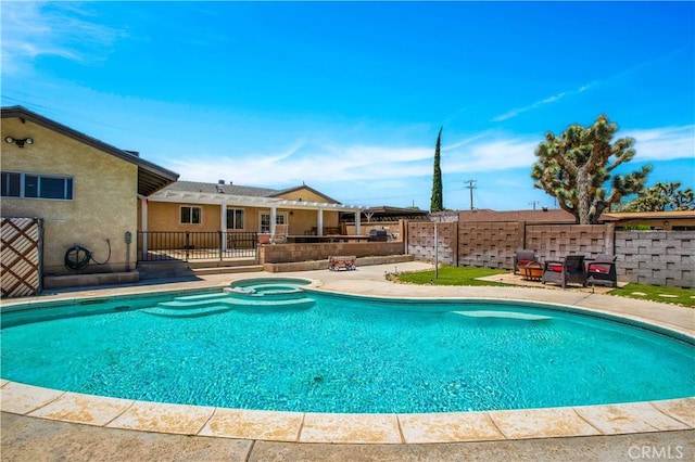 view of pool featuring an in ground hot tub and a patio