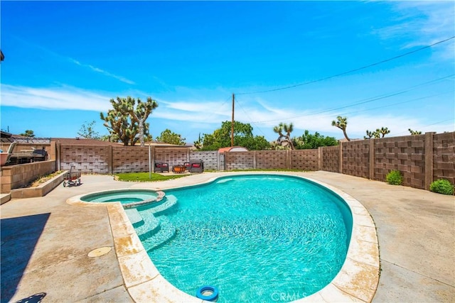 view of swimming pool featuring an in ground hot tub