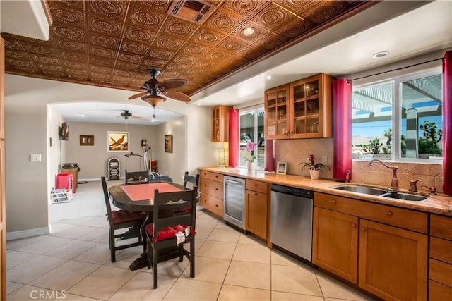 kitchen with dishwasher, wine cooler, sink, ceiling fan, and light tile patterned floors