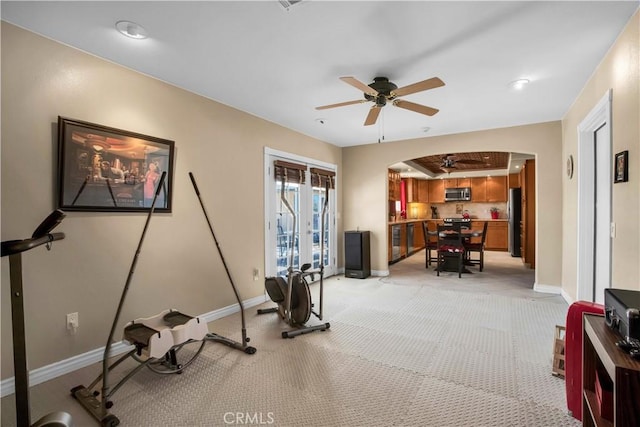 exercise room with ceiling fan