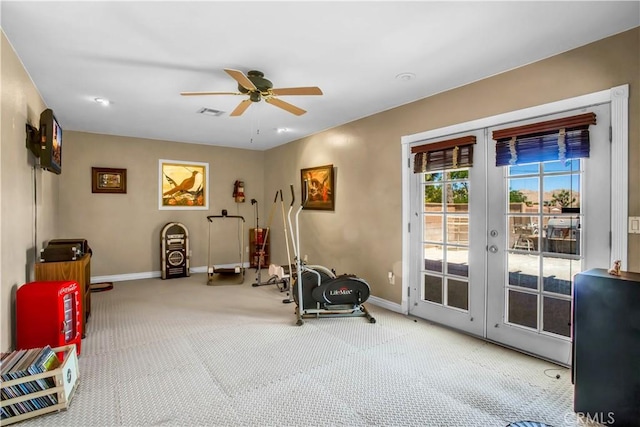 exercise room with ceiling fan, french doors, and carpet floors