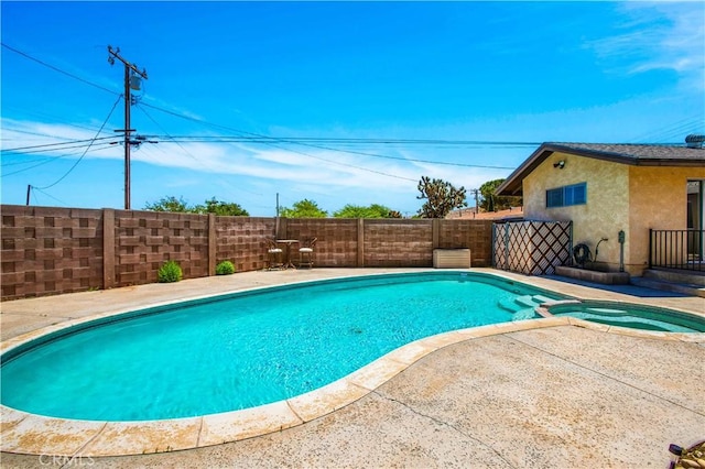 view of swimming pool featuring a patio area