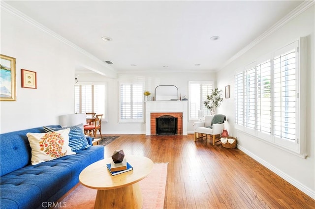 living room featuring ornamental molding, plenty of natural light, and wood finished floors