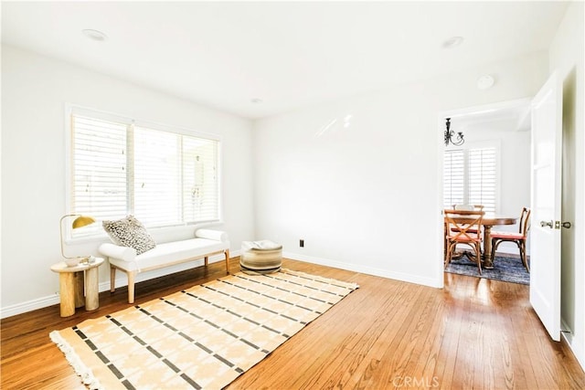 sitting room with hardwood / wood-style floors and a wealth of natural light