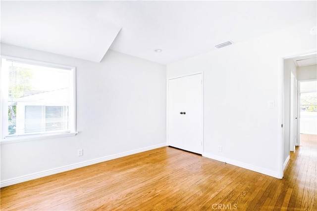 unfurnished room featuring light wood-type flooring