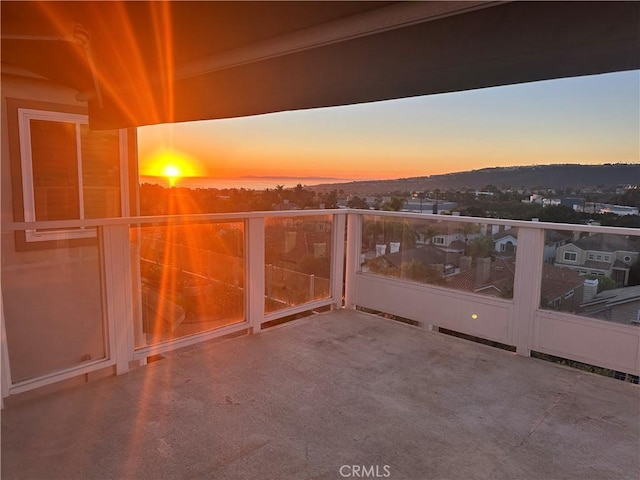 view of balcony at dusk