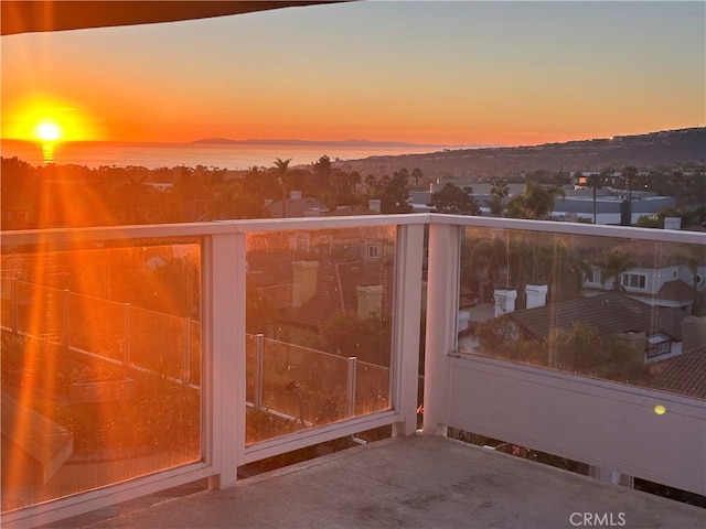 balcony at dusk with a water view