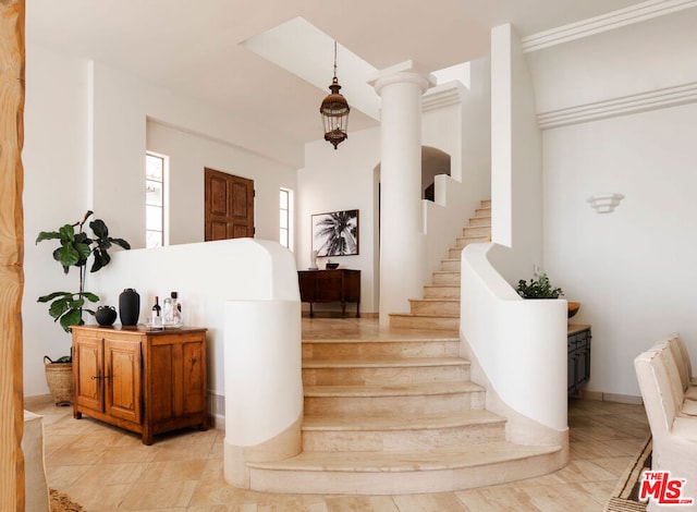 stairs featuring ornate columns