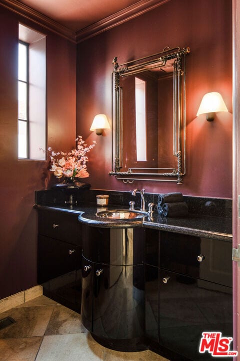 bathroom with vanity and crown molding