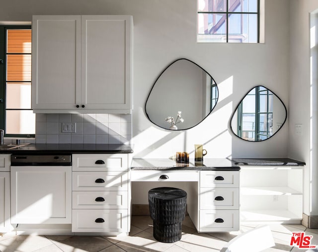 bathroom featuring tasteful backsplash and tile patterned floors