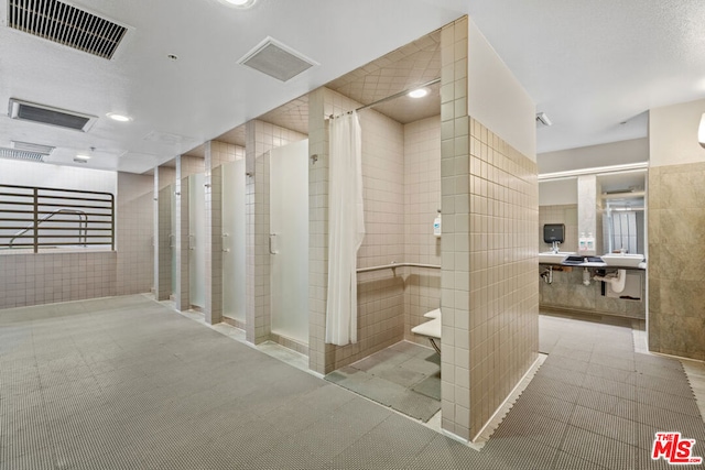 hallway with tile walls