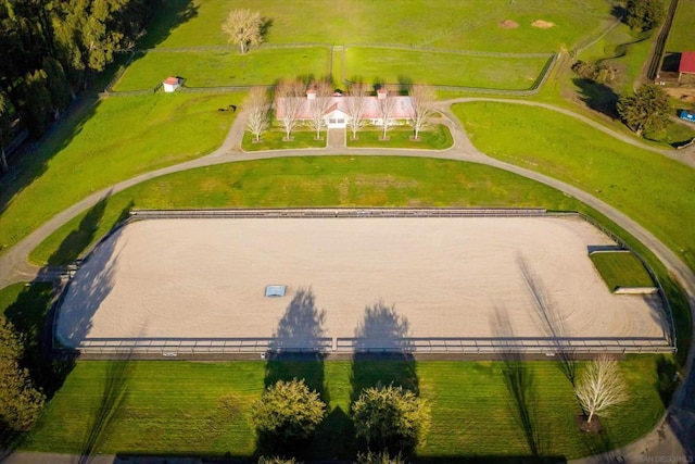 birds eye view of property with a rural view