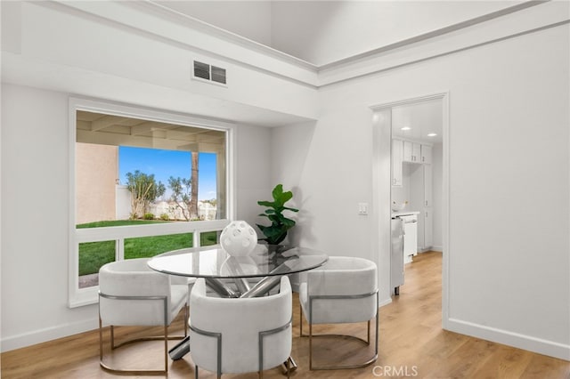 dining area with light hardwood / wood-style flooring