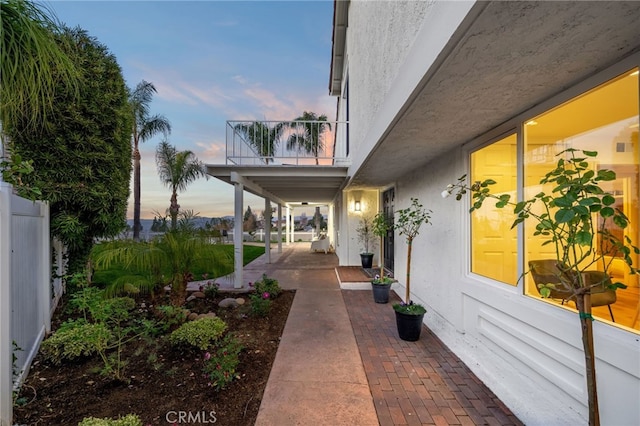 patio terrace at dusk with a balcony