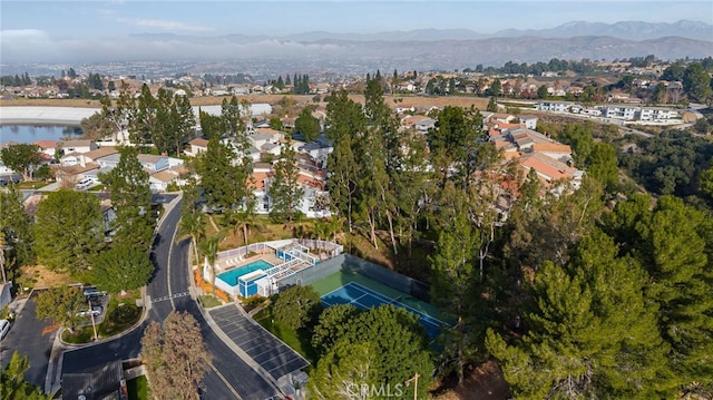 birds eye view of property featuring a mountain view