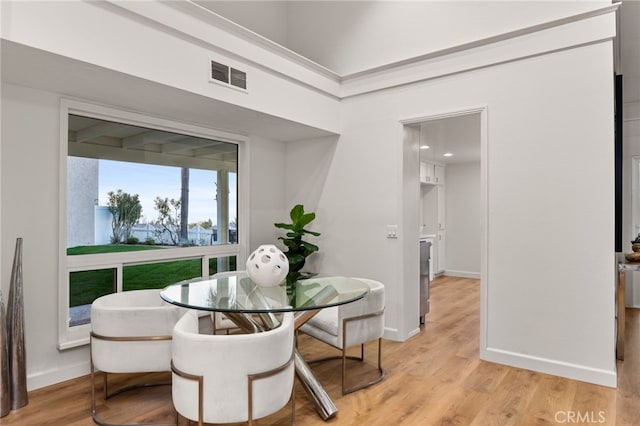 dining area with light hardwood / wood-style flooring