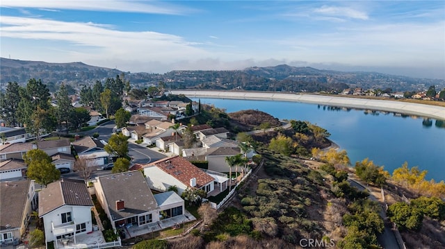 birds eye view of property featuring a water and mountain view