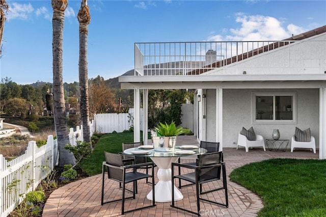 view of patio featuring a balcony