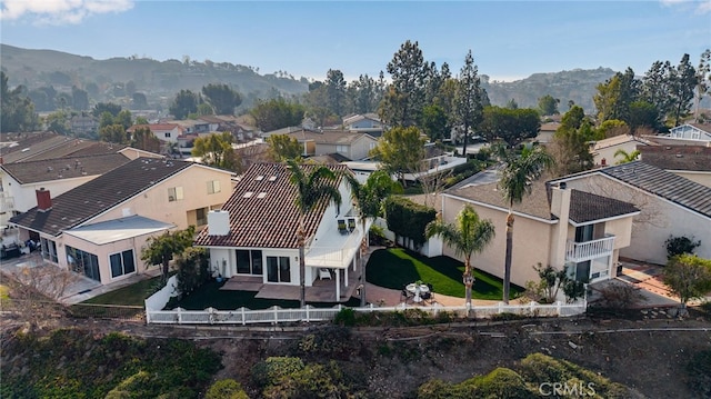 birds eye view of property with a mountain view