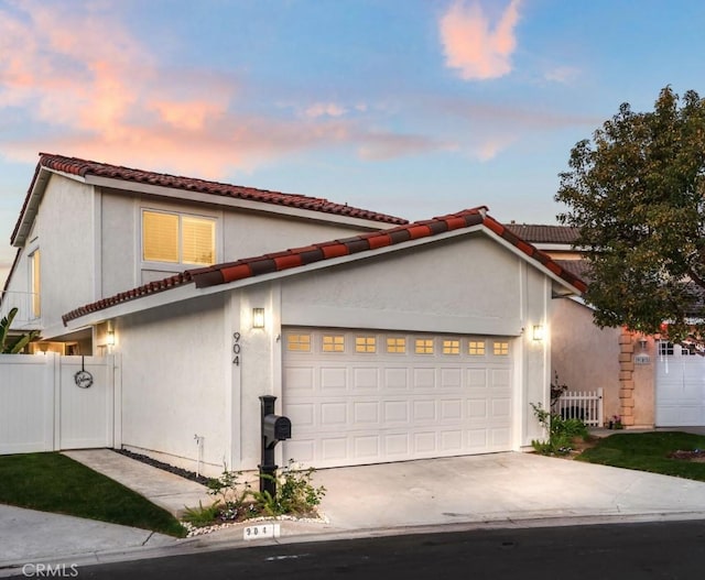 mediterranean / spanish-style home featuring a garage