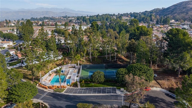 birds eye view of property featuring a mountain view