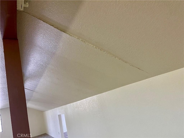 interior details featuring a textured ceiling