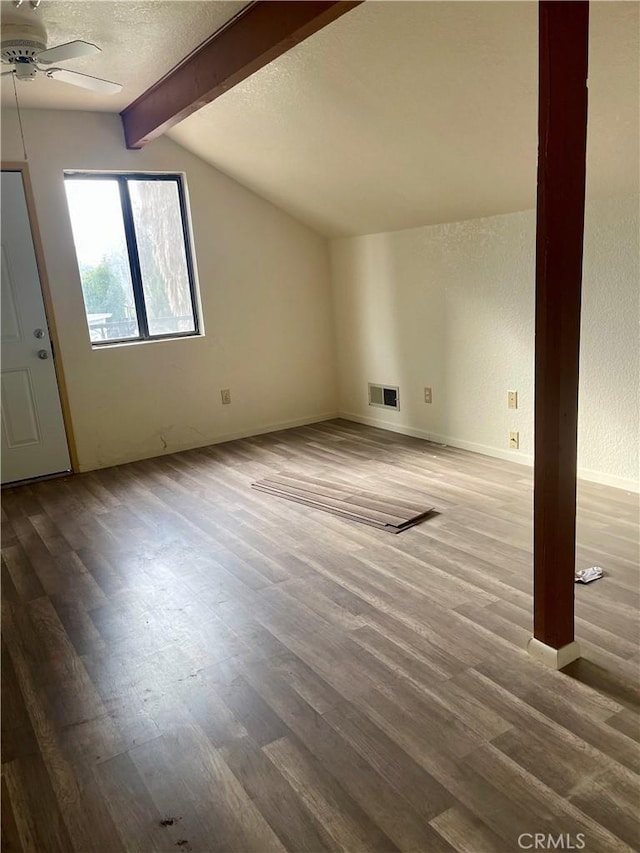 bonus room with a textured ceiling, ceiling fan, hardwood / wood-style floors, and lofted ceiling with beams