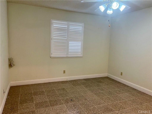 spare room featuring ceiling fan