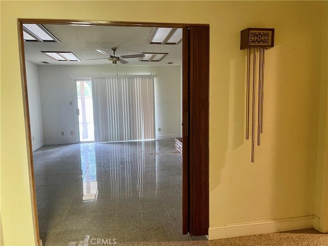 spare room with ceiling fan