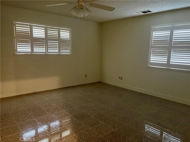 spare room with ceiling fan