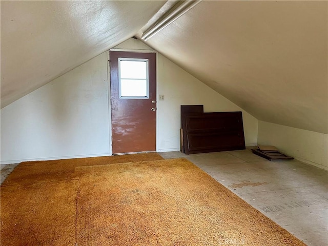 additional living space featuring vaulted ceiling