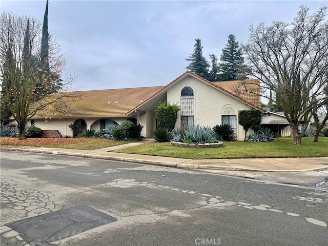 view of front of home with a front yard