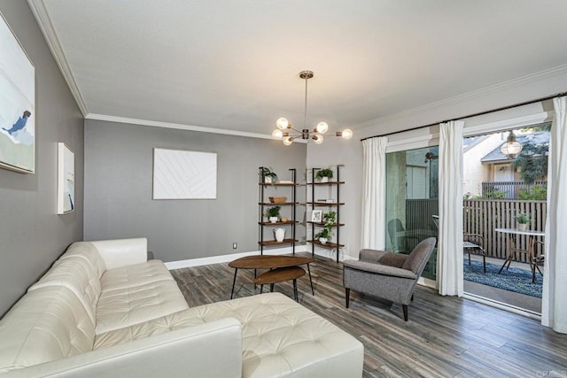 living room with crown molding, dark hardwood / wood-style floors, and a notable chandelier