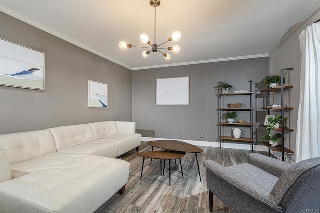 living room featuring crown molding, wood-type flooring, and a chandelier