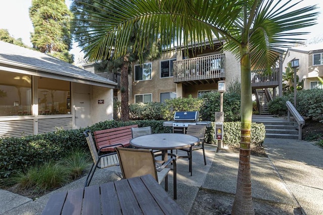 view of patio featuring a grill