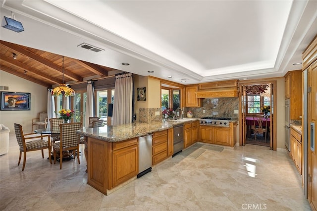 kitchen featuring vaulted ceiling, pendant lighting, kitchen peninsula, decorative backsplash, and wood ceiling