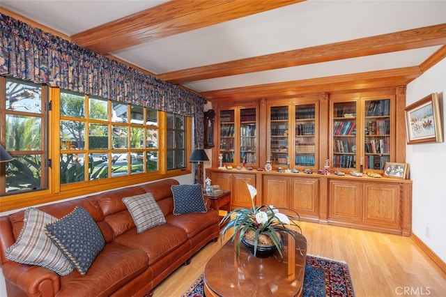 living room featuring hardwood / wood-style floors and beamed ceiling