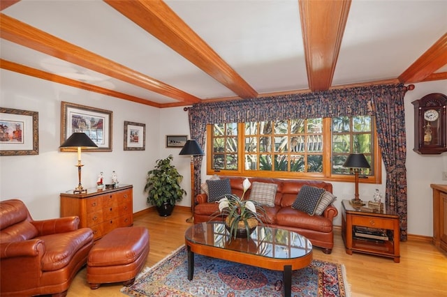 living room with beam ceiling and light wood-type flooring