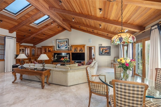 living room with beam ceiling, a skylight, wood ceiling, and high vaulted ceiling