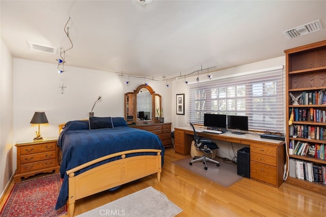 bedroom featuring light wood-type flooring