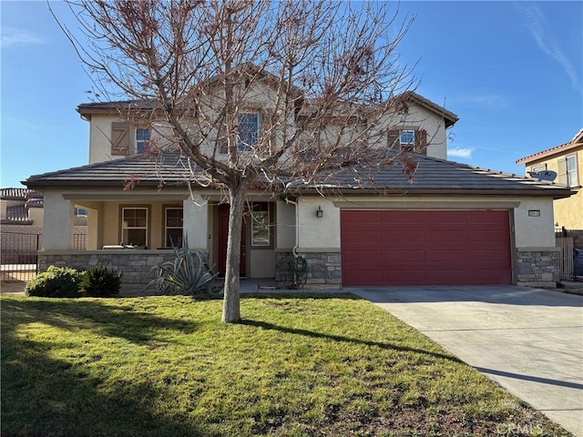 view of front of home with a garage and a front yard