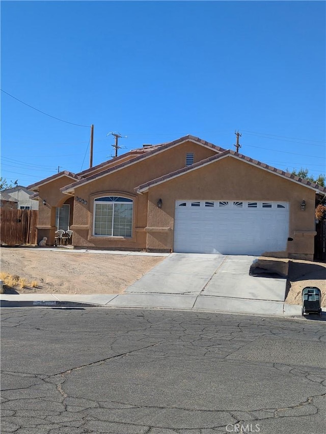 single story home featuring a garage