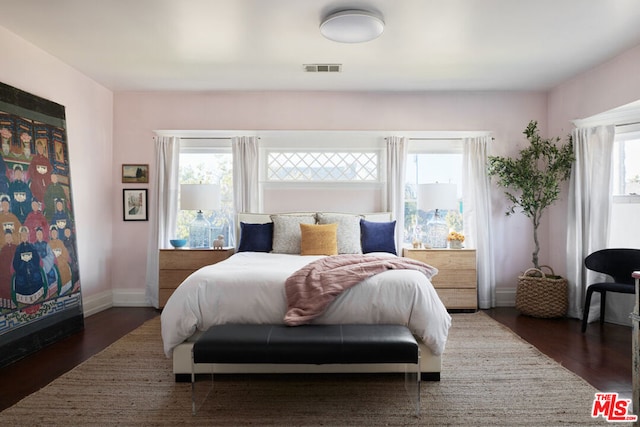 bedroom featuring dark hardwood / wood-style flooring