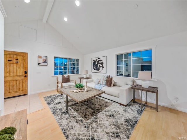 living room featuring wood-type flooring, high vaulted ceiling, and beam ceiling