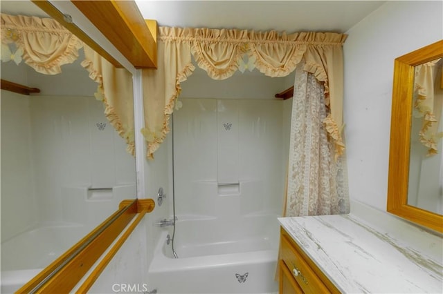 bathroom featuring bathing tub / shower combination and vanity