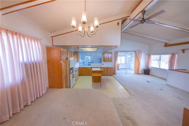 kitchen with ceiling fan with notable chandelier, light colored carpet, lofted ceiling with beams, and hanging light fixtures