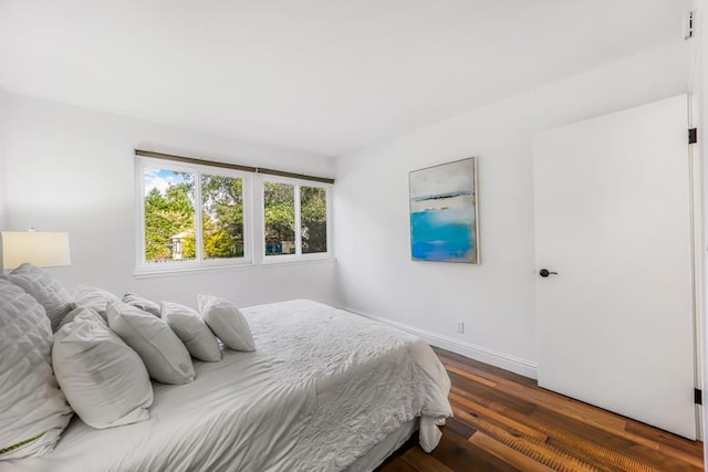 bedroom featuring dark hardwood / wood-style floors