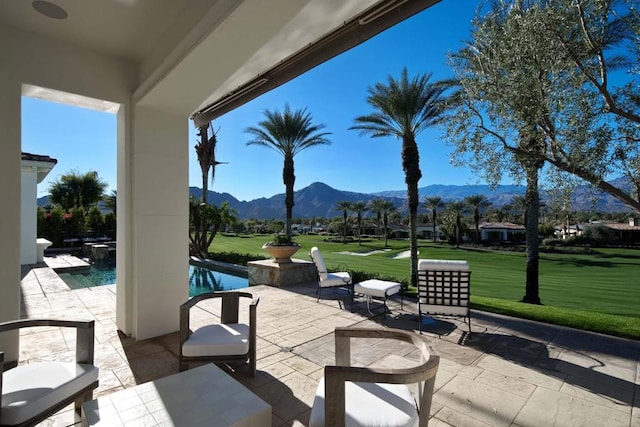 view of patio / terrace with a mountain view