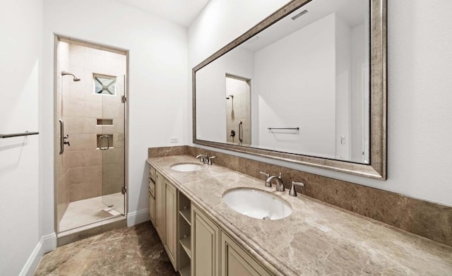 bathroom featuring vanity and a shower with door