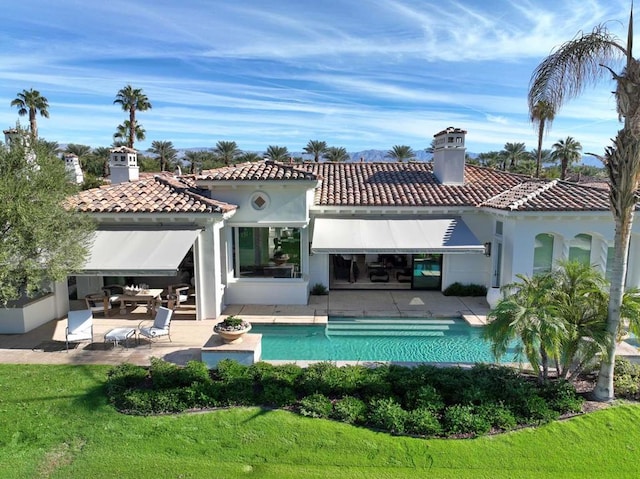 rear view of property with a patio area